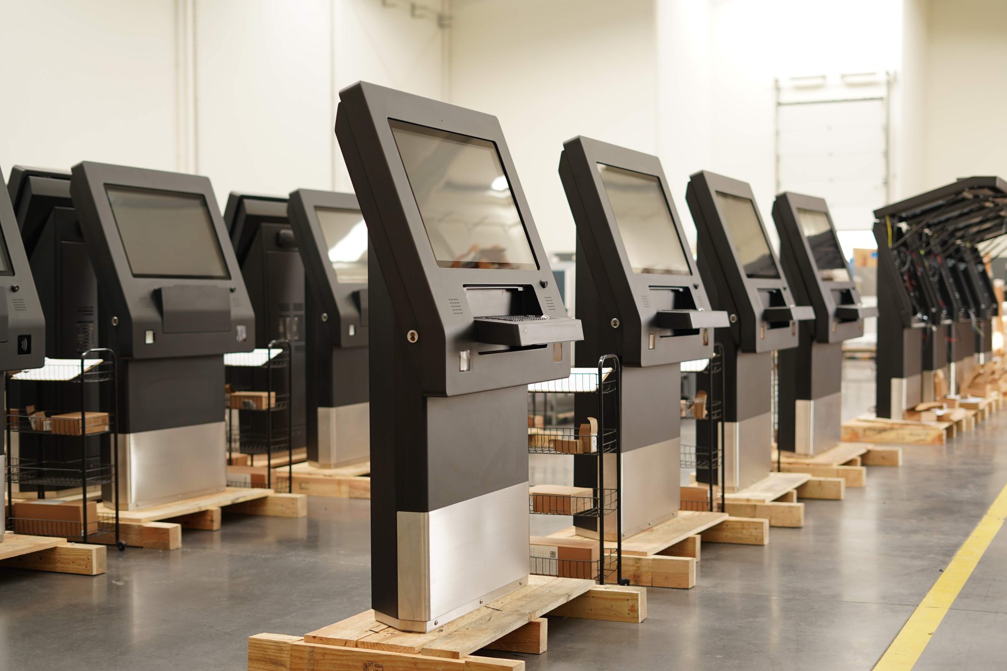 Row of Moobo self-service kiosks crated and ready to ship